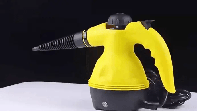Yellow handheld steam cleaner with precision nozzle for home cleaning tasks