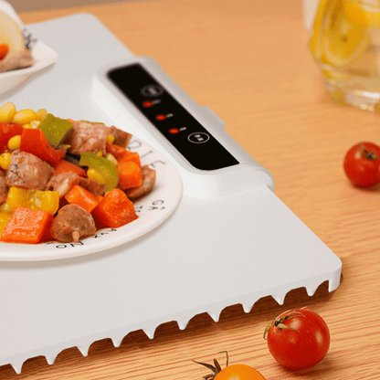 Close-up of foldable electric food warmer panel with control display and heating surface