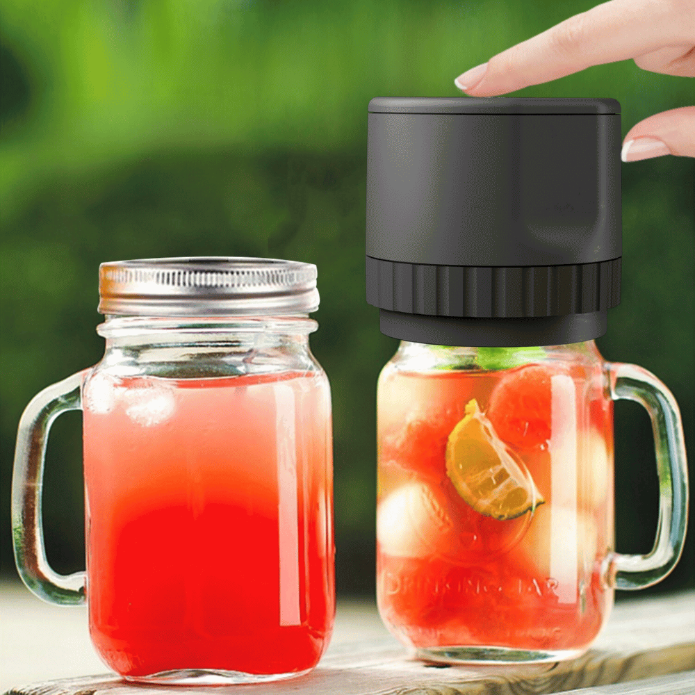 Black electric vacuum jar sealer in use on drink jars, preserving beverages with airtight technology