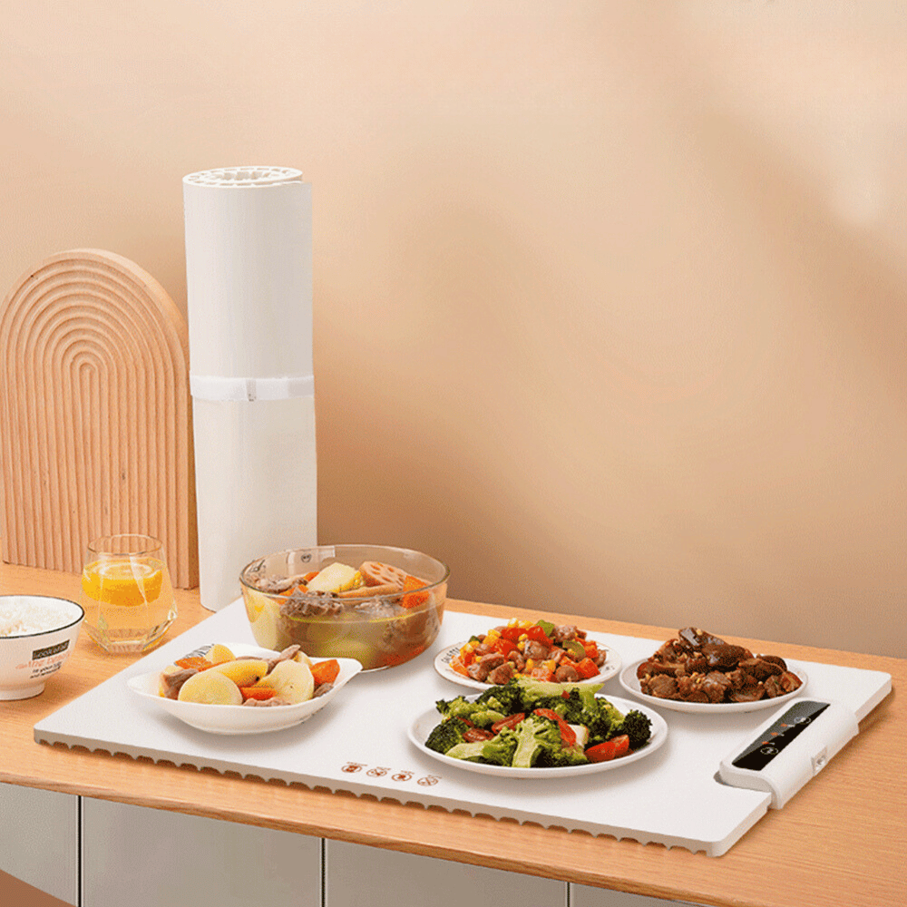 Modern foldable food warmer in use on a kitchen counter keeping plates hot during meals