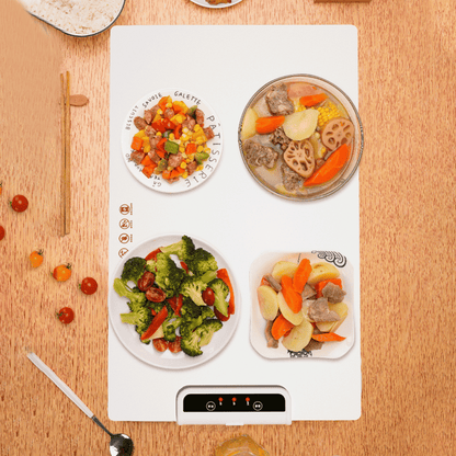 Top-down view of foldable food warmer heating various meals simultaneously on dining table