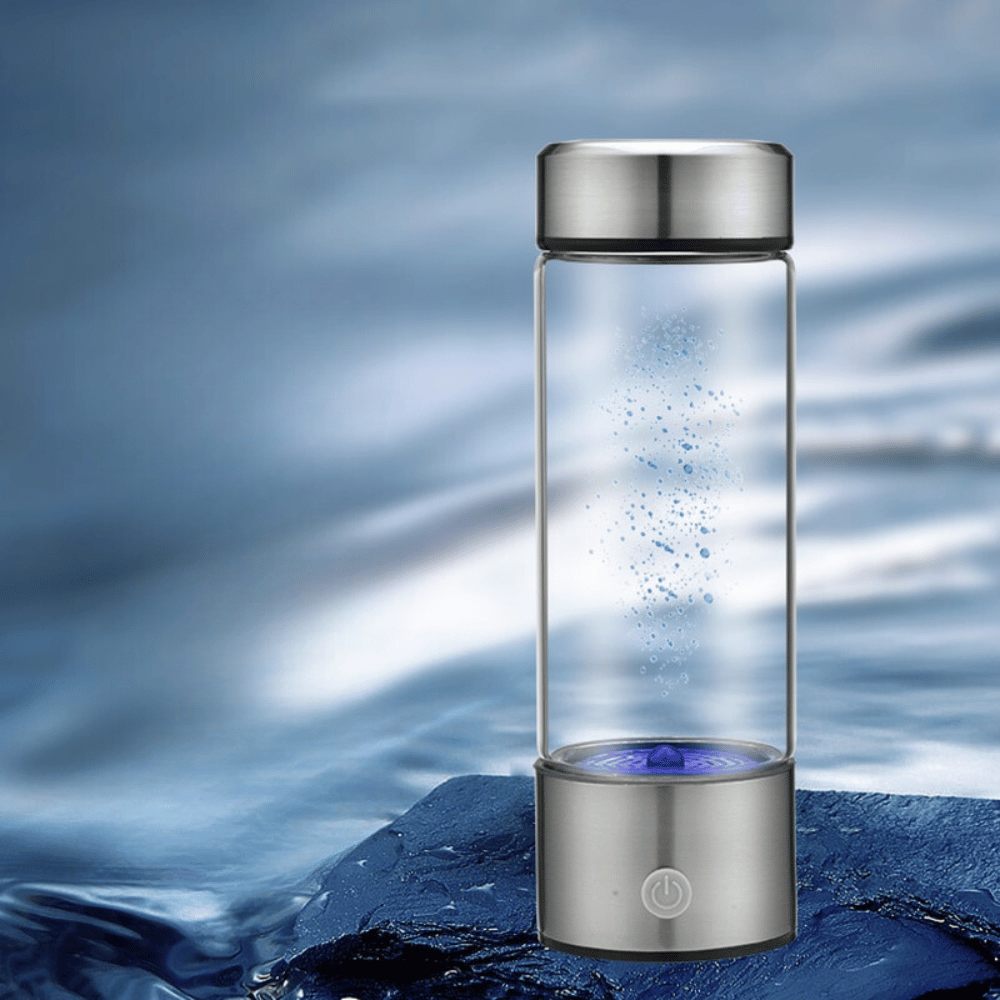 Hydrogen-rich water bottle standing on icy surface, symbolizing purity and health benefits.
