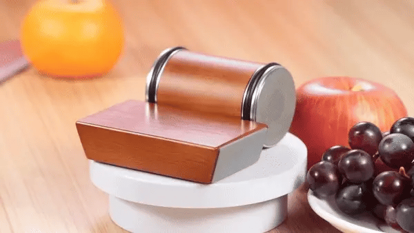 Wooden magnetic rolling knife sharpener on kitchen counter for fast and precise blade honing