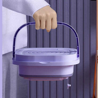 Folded washing machine carried by handle, lightweight and portable for travel or dorm use